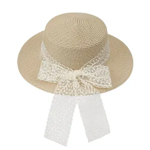 Summer beige woven straw hat with white lace ribbon bow and floral embroidery details