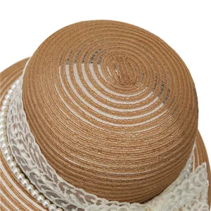 Elegant French Hepburn straw hat with delicate white lace trim and pearl accents