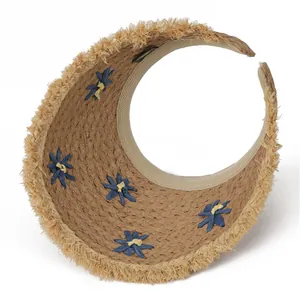 Brown woven straw sun visor hat with blue floral accents and fringed brim for beach vacation