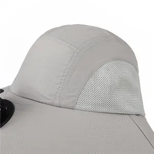 Close-up of lightweight grey outdoor sun hat with cooling fan and breathable mesh