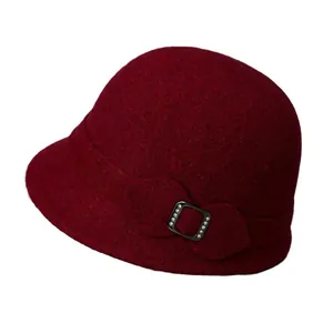 Elegant deep red wool bucket hat for older women featuring a rhinestone bow detail