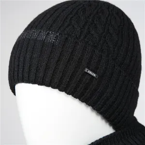 Thick black knitted beanie with vertical ribs and twist pattern for men in winter