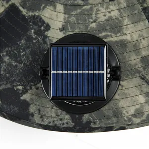 Close-up of the solar panel and fan assembly on a camouflage wide brim outdoor sun hat