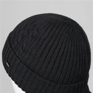Men's winter knit beanie hat in black with vertical ribbing and cable stitch detail