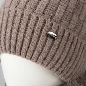 Brown knit rabbit fur beanie for elderly women featuring a warm fleece lining