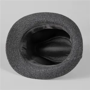 Detail view showing black satin inner lining and sweatband of wool felt fedora hat