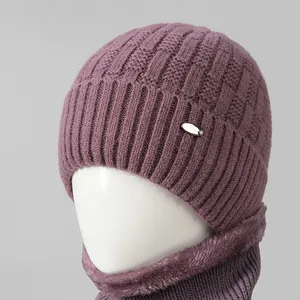 Close-up of purple knit hat with waffle texture and warm faux fur lining detail