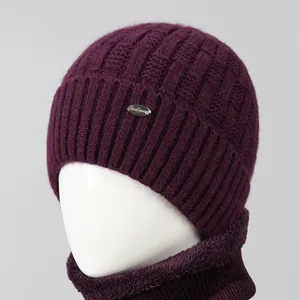 Close-up of deep purple knit hat and fleece-lined snood set for elderly women
