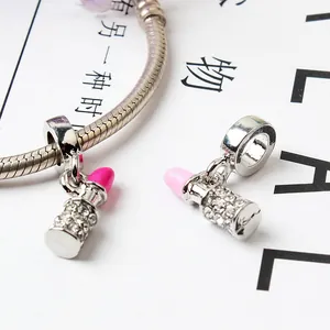 Lipstick charm bracelet with silver snake chain and rhinestone lipstick pendants