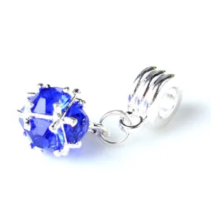 Detailed view of dark blue faceted crystal charm with silver large-hole bail for bracelets