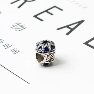 Macro view showing the S925 silver stamp and blue enamel on the hollowed-out charm bead