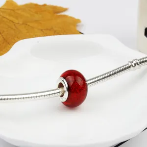 Ruby glitter glass charm bead on silver snake chain bracelet for DIY jewelry design