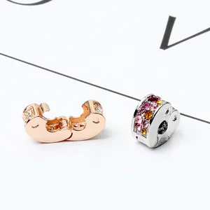 Rose gold and silver heart charms with colorful pavé crystals and stopper clasp design