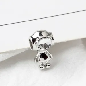Macro shot of a silver polished astronaut charm pendant for DIY bracelet jewelry making