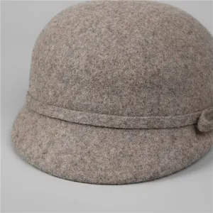 Macro view of textured wool felt fabric and decorative knot on the vintage riding cap