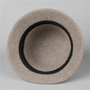 Interior view of beige wool fedora hat for women with black inner sweatband and label