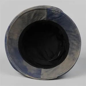 Inside view of an elegant blue-grey wash bucket hat with black lining and sweatband