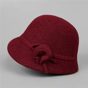 Detail of elegant wool cloche hat for women featuring a 3D flower decoration in burgundy