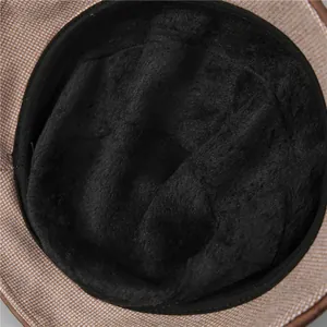 Close-up of thick black fleece lining in a winter bucket hat for warmth and comfort