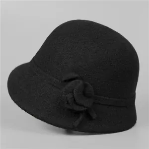 Detail of wool cloche hat showing exquisite 3D flower decoration and premium felt texture