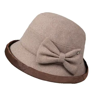 Elegant brown plaid cloche hat for elderly women with velvet brim and bow decoration