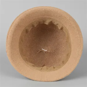 Inside view of warm knitted bucket hat for elderly women showing soft lining and stitching