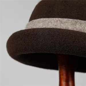 Elegant wool felt cloche hat for women in dark brown with textured ribbon detail
