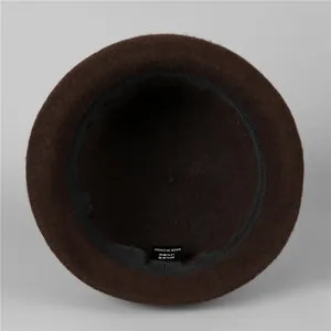 Elegant wool blend cloche hat for women showing interior lining and material label