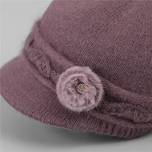 Women's deep purple winter knitted hat with warm faux fur trim and crystal flower detail