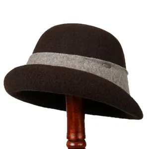 Elegant dark brown wool fedora bucket hat with knit band and metallic emblem for winter