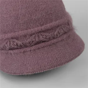 Detail of soft purple knit hat showing fuzzy mohair texture and cable knit patterns