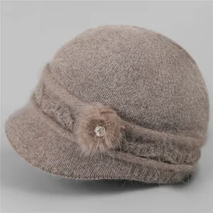 Detailed texture of thick knit winter hat with plush faux fur and rhinestone accent