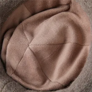 Detailed macro view of the warm fleece lining inside the brown knit bucket hat
