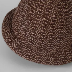 Close-up of thick mixed-brown knit texture and wool blend fabric on warm bucket hat