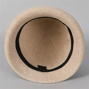 Elegant French vintage wool felt cloche hat in beige featuring an internal sweatband detail