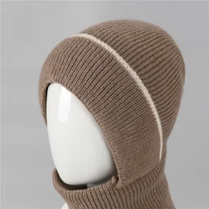 Detail of coffee knit balaclava with white stripes showing ribbed texture and warm fleece