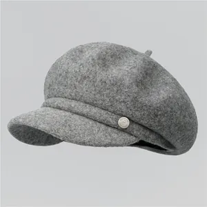 Grey wool octagonal newsboy hat with silver metal logo button for women