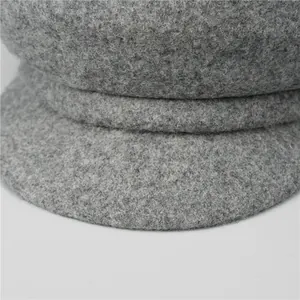 Close-up of high-quality dark grey wool octagonal hat with thick fuzzy texture