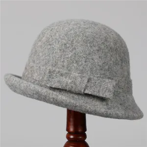 Detail of the elegant grey wool felt cloche hat with a matching ribbon and bow accent