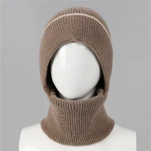 Detailed knit texture of brown balaclava with white stripe on mannequin
