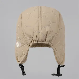 Quilted winter trapper hat for women with warm fleece lining and adjustable strap