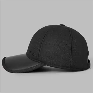 Detailed side view of black winter baseball cap with sports logo and warm fabric texture