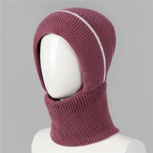 Close-up of purple knit balaclava hat with white stripes and ribbed warm wool texture