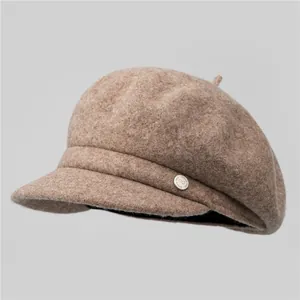 Classic wool blend newsboy cap in camel with a decorative metallic side plate