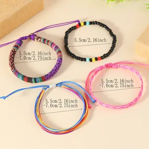 Detailed view of bohemian braided bracelets with colorful beads and adjustable sizes