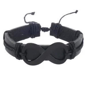 Dettaglio di bracciale in pelle nera con simbolo dell'infinito opaco e lacci intrecciati