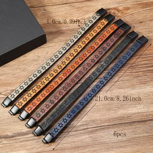 Set of 6 hexagram embossed leather bracelets with magnetic clasps on wood background