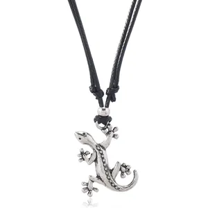 Detail of gecko pendant in vintage silver finish with textured skin on black cord