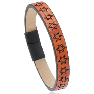 Detail view of orange leather bracelet with black Star of David prints and magnetic clasp