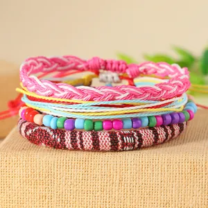 Handmade bohemian colorful woven bracelet set featuring ethnic patterns and resin beads